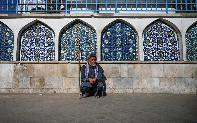 A man sits outside the Pul-e Khishti mosque at the start of the Eid al-Fitr festival which marks the end of the Muslim holy month of Ramadan in Kabul on May 24, 2020 (WAKIL KOHSAR / AFP)