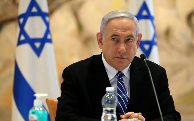 Prime Minister Benjamin Netanyahu attends a cabinet meeting of the new government at Chagall State Hall in the Knesset in Jerusalem on May 24, 2020. (ABIR SULTAN / POOL / AFP) Prime Minister Benjamin Netanyahu attends a cabinet meeting of the new government at Chagall State Hall in the Knesset in Jerusalem on May 24, 2020. (ABIR SULTAN / POOL / AFP)