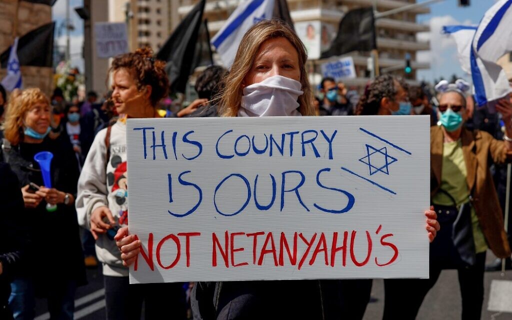 Protesters rally against Prime Minister Benjamin Netanyahu outside his residence in Jerusalem on May 24, 2020. (Emmanuel Dunand/AFP) Protesters rally against Prime Minister Benjamin Netanyahu outside his residence in Jerusalem on May 24, 2020. (Emmanuel Dunand/AFP)