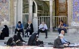 Muslim worshippers read the Koran at the Shah Abdol-Azim shrine in the Iranian capital Tehran on May 25, 2020, after the reopening of major Shiite shrines across the country following their closure due to the coronavirus pandemic. (Stringer/AFP)