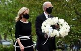 Democratic presidential candidate and former US Vice President Joe Biden with his wife Jill Biden, pay their respects to fallen service members on Memorial Day at Delaware Memorial Bridge Veteran's Memorial Park in Wilmington, Delaware, May 25, 2020. (Olivier DOULIERY / AFP)