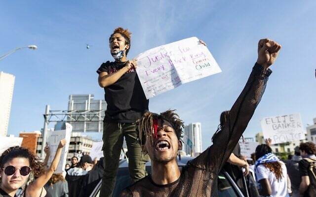Protesters shut down the highway I 95 North as they protest police brutality in Miami, Florida on May 30, 2020 (Adam DelGiudice / AFP) Protesters shut down the highway I 95 North as they protest police brutality in Miami, Florida on May 30, 2020 (Adam DelGiudice / AFP)