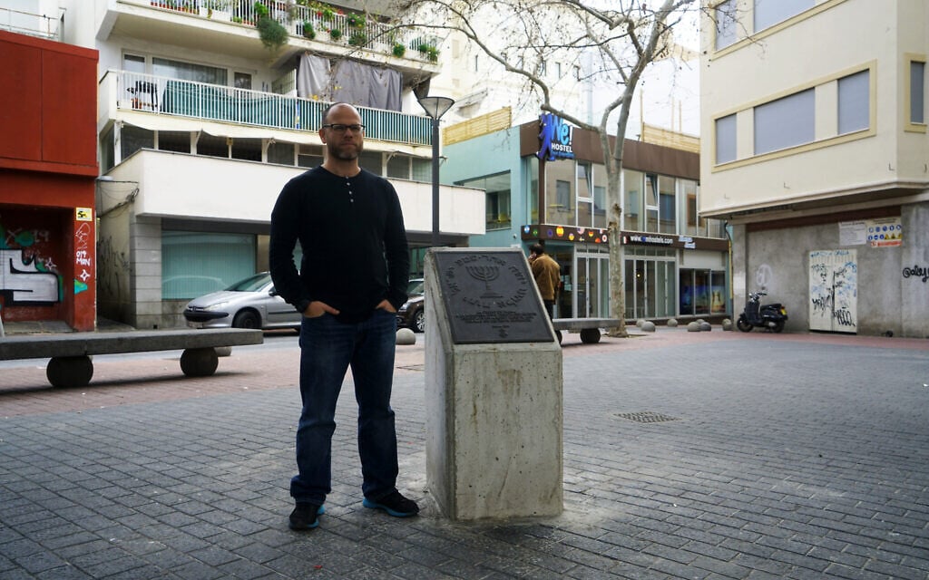 Dani Rotstein stands next to a monument commemorating the Jews of Palma de Mallorca, Spain, February 13, 2019. (Cnaan Liphshiz/ JTA)