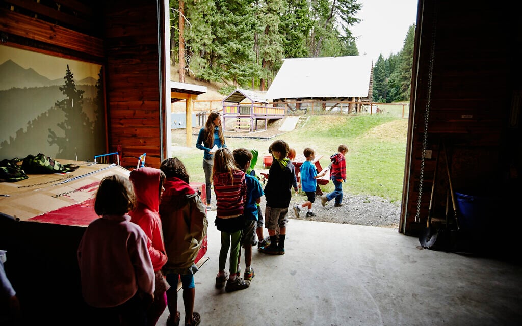 A counselor lines up campers to go outside. (Getty Images)