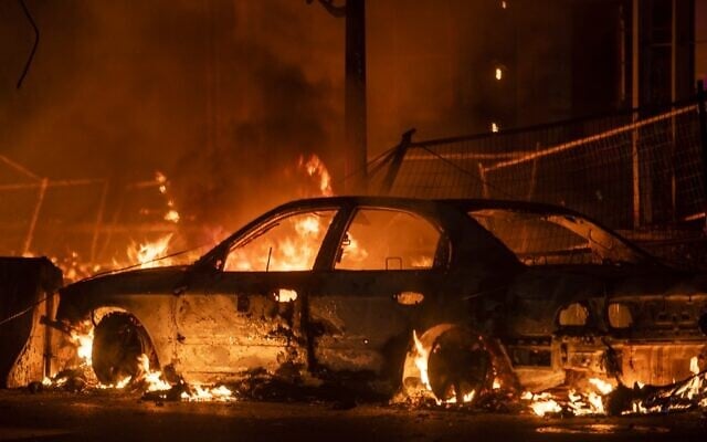 A car burns near the Third Police Precinct on May 27, 2020 in Minneapolis, Minnesota, during riots speaked by the police killing of George Floyd. (Stephen Maturen/Getty Images/AFP) A car burns near the Third Police Precinct on May 27, 2020 in Minneapolis, Minnesota, during riots speaked by the police killing of George Floyd. (Stephen Maturen/Getty Images/AFP)