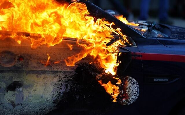 A burning police car is seen during a protest over the Minneapolis death of George Floyd while in police custody on May 29, 2020 in Atlanta, Georgia (Elijah Nouvelage/Getty Images/AFP)