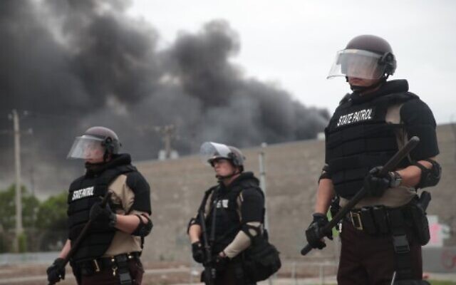 Police hold a line on the fourth day of protests on May 29, 2020 in Minneapolis, Minnesota. The National Guard has been activated as protests continue after the death of George Floyd which has caused widespread destruction and fires across Minneapolis and St. Paul. (Scott Olson/Getty Images/AFP) Police hold a line on the fourth day of protests on May 29, 2020 in Minneapolis, Minnesota. The National Guard has been activated as protests continue after the death of George Floyd which has caused widespread destruction and fires across Minneapolis and St. Paul. (Scott Olson/Getty Images/AFP)