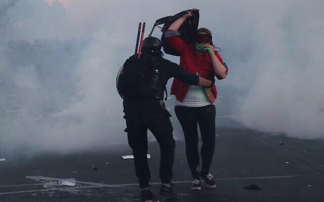 Demonstrators hurry away from a cloud of tear gas as police advance during a protest of the killing of George Floyd on May 30, 2020 in Minneapolis, Minnesota (Scott Olson/Getty Images/AFP) Demonstrators hurry away from a cloud of tear gas as police advance during a protest of the killing of George Floyd on May 30, 2020 in Minneapolis, Minnesota (Scott Olson/Getty Images/AFP)