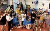 Year Course students this spring wear masks while volunteering. (Courtesy of Year Course/ via JTA)