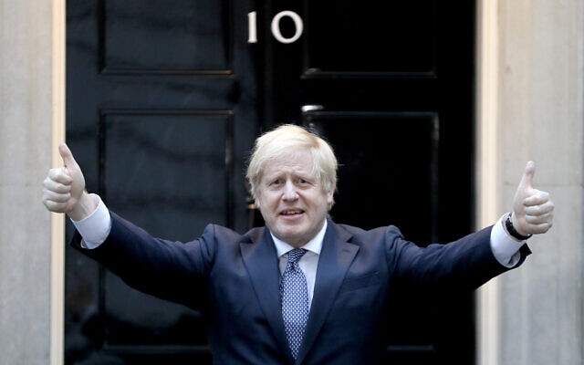 Britain's Prime Minister Boris Johnson shows thumbs up before he applauds on the doorstep of 10 Downing Street in London during the weekly 'Clap for our Carers,' April 30, 2020. (Kirsty Wigglesworth/AP) Britain's Prime Minister Boris Johnson shows thumbs up before he applauds on the doorstep of 10 Downing Street in London during the weekly 'Clap for our Carers,' April 30, 2020. (Kirsty Wigglesworth/AP)