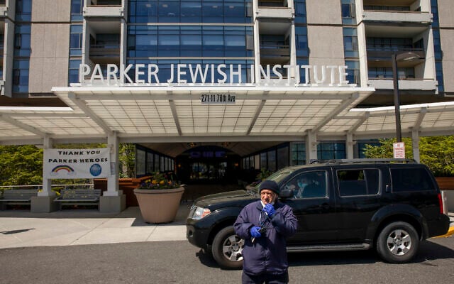 A security guard stands in the drive at the Parker Jewish Institute for Healthcare and Rehabilitation, Monday, May 4, 2020, in the Queens borough of New York. New York state is reporting more than 1,700 previously undisclosed deaths at nursing homes and adult care facilities as the state faces scrutiny over how it's protected vulnerable residents during the coronavirus pandemic. Parker Jewish Institute reported the highest number of deaths: 71.(AP Photo/Marshall Ritzel) A security guard stands in the drive at the Parker Jewish Institute for Healthcare and Rehabilitation, Monday, May 4, 2020, in the Queens borough of New York. New York state is reporting more than 1,700 previously undisclosed deaths at nursing homes and adult care facilities as the state faces scrutiny over how it's protected vulnerable residents during the coronavirus pandemic. Parker Jewish Institute reported the highest number of deaths: 71.(AP Photo/Marshall Ritzel)