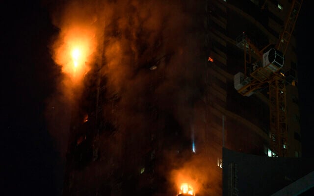 A fire burns on the side of a high-rise building in Sharjah, United Arab Emirates, Tuesday, May 5, 2020. A high-rise tower caught fire Tuesday in the United Arab Emirates and authorities said it wasn't immediately clear what caused the blaze. (AP Photo/Jon Gambrell) A fire burns on the side of a high-rise building in Sharjah, United Arab Emirates, Tuesday, May 5, 2020. A high-rise tower caught fire Tuesday in the United Arab Emirates and authorities said it wasn't immediately clear what caused the blaze. (AP Photo/Jon Gambrell)
