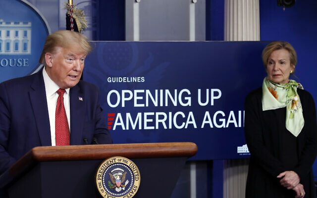 US President Donald Trump speaks about the coronavirus in the James Brady Press Briefing Room of the White House in Washington on April 16, 2020, as Dr. Deborah Birx, White House coronavirus response coordinator, listens. (AP Photo/Alex Brandon, File) US President Donald Trump speaks about the coronavirus in the James Brady Press Briefing Room of the White House in Washington on April 16, 2020, as Dr. Deborah Birx, White House coronavirus response coordinator, listens. (AP Photo/Alex Brandon, File)