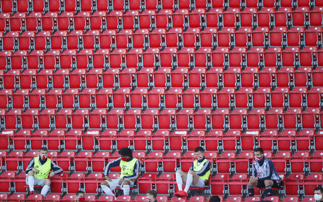 Substitute players of Bayern Munich are seen during the German Bundesliga soccer match between Union Berlin and Bayern Munich in Berlin, Germany on May 17, 2020. (AP/Hannibal Hanschke, Pool) Substitute players of Bayern Munich are seen during the German Bundesliga soccer match between Union Berlin and Bayern Munich in Berlin, Germany on May 17, 2020. (AP/Hannibal Hanschke, Pool)