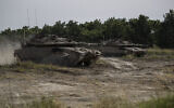 Israeli tanks participating in a military conduct a drills in northern Israel, May 13, 2020. (Tsafrir Abayov/AP)