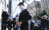 Michael Cohen arrives at his Manhattan apartment in New York after being released federal prison, May 21, 2020. (AP Photo/John Minchillo)