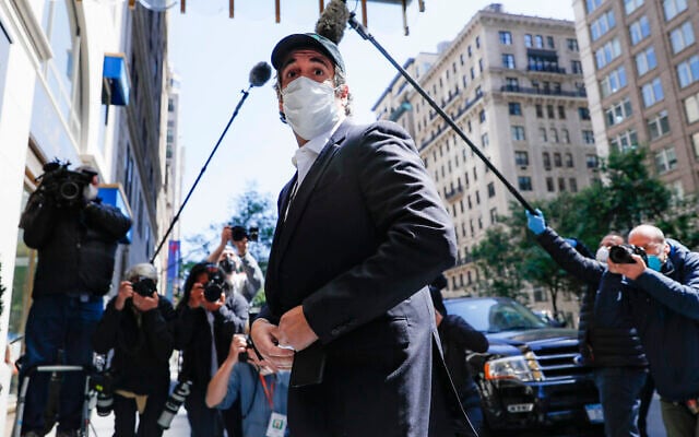 Michael Cohen arrives at his Manhattan apartment in New York after being released federal prison, May 21, 2020. (AP Photo/John Minchillo) Michael Cohen arrives at his Manhattan apartment in New York after being released federal prison, May 21, 2020. (AP Photo/John Minchillo)