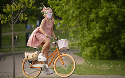 A cyclist rides the path around Lake Harriet on Memorial Day in Minneapolis on May 25, 2020. (Jeff Wheeler/Star Tribune via AP)