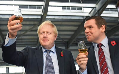 Britain's Prime Minister Boris Johnson (L)with  Douglas Ross, parliamentary under-secretary of state for Scotland, in Moray, Scotland, November 7, 2019.  (Stefan Rousseau / PA via AP)