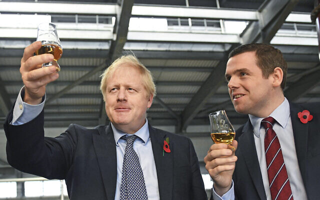 Britain's Prime Minister Boris Johnson (L)with Douglas Ross, parliamentary under-secretary of state for Scotland, in Moray, Scotland, November 7, 2019. (Stefan Rousseau / PA via AP) Britain's Prime Minister Boris Johnson (L)with Douglas Ross, parliamentary under-secretary of state for Scotland, in Moray, Scotland, November 7, 2019. (Stefan Rousseau / PA via AP)