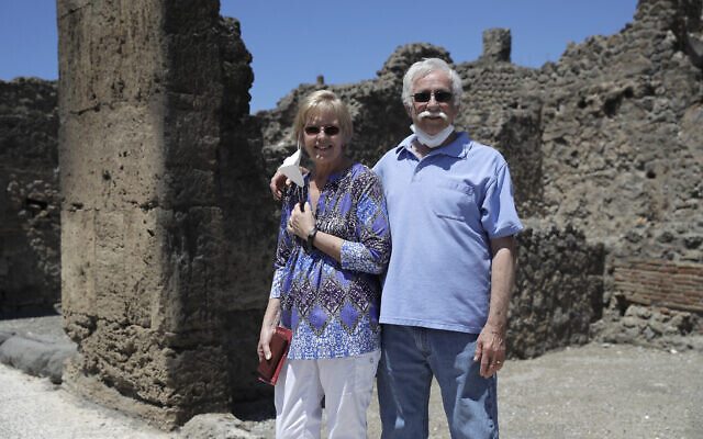 Colleen and Marvin Hewson, from the United States, pose for a photograph during their visit to the archeological sites of Pompeii, near Naples, southern Italy, May 26, 2020. (AP Photo/Alessandra Tarantino) Colleen and Marvin Hewson, from the United States, pose for a photograph during their visit to the archeological sites of Pompeii, near Naples, southern Italy, May 26, 2020. (AP Photo/Alessandra Tarantino)
