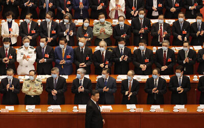 Chinese President Xi Jinping, bottom, arrives for the closing session of the Chinese People's Political Consultative Conference (CPPCC) at the Great Hall of the People in Beijing on May 27, 2020. (AP Photo/Andy Wong)