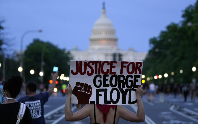 Illustrative: Demonstrators walk along Pennsylvania Avenue as they protest the death of George Floyd, a black man who died in police custody in Minneapolis, Friday, May 29, 2020, in Washington. (AP/Evan Vucci) Illustrative: Demonstrators walk along Pennsylvania Avenue as they protest the death of George Floyd, a black man who died in police custody in Minneapolis, Friday, May 29, 2020, in Washington. (AP/Evan Vucci)