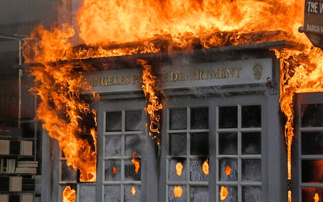 A Los Angeles Police Department kiosk is seen ablaze in The Grove shopping center during a US protest over the death of George Floyd, May 30, 2020, in Los Angeles. (AP Photo/Mark J. Terrill) A Los Angeles Police Department kiosk is seen ablaze in The Grove shopping center during a US protest over the death of George Floyd, May 30, 2020, in Los Angeles. (AP Photo/Mark J. Terrill)