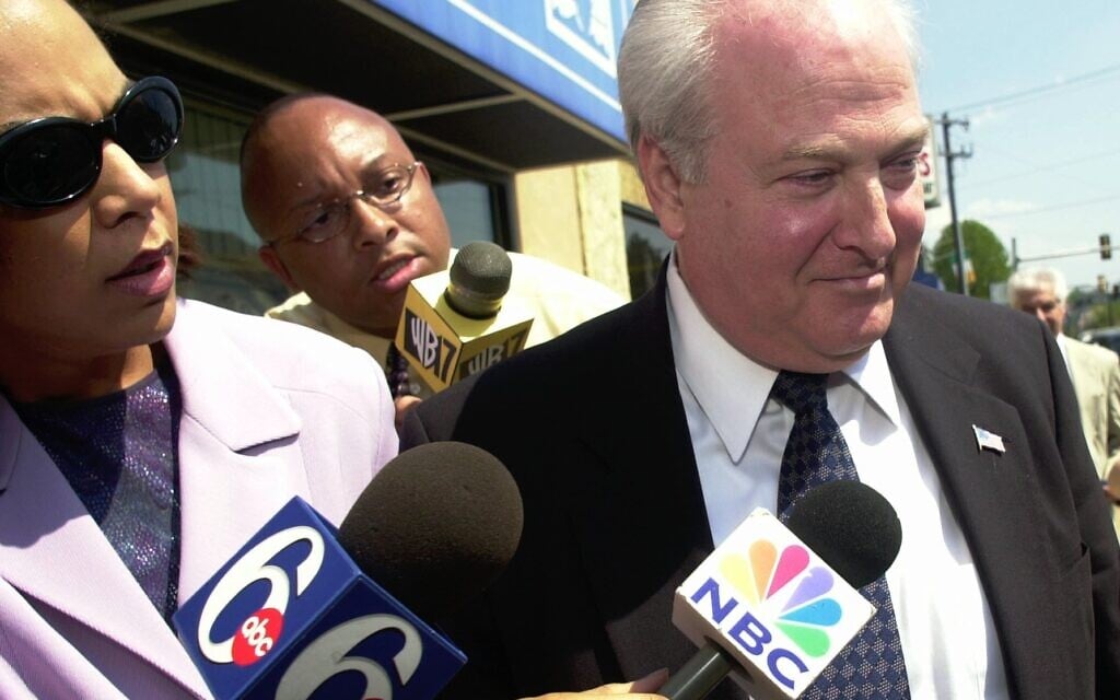 Howard Nevison, a prominent New York City cantor, avoids answering media questions as he leaves his preliminary hearing Wednesday, April 17, 2002, in Narberth, Pennsylvania. (AP Photo/Dan Loh)
