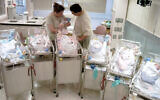 Illustrative. Parents with newborn sextuplets, in the neonatal unit, at St. Johns Mercy Medical Center in Creve Coeur, Missouri, May 21, 2004. (Kyle Ericson/AP/File)