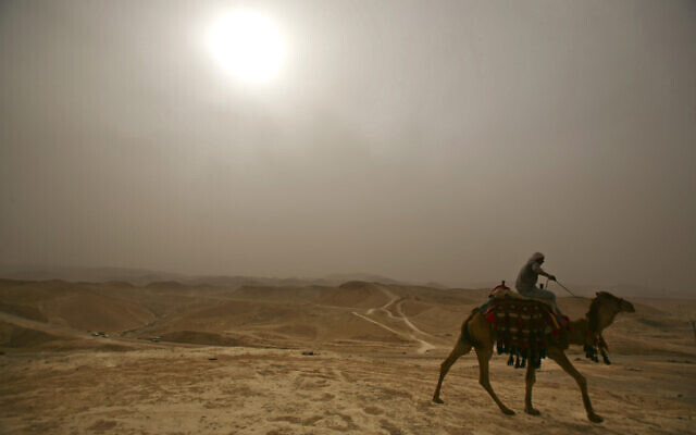 A Palestinian rides his camel in the haze next to Nebi Musa Mosque, not seen, near the West Bank town of Jericho during a heat wave on May 4, 2009. (AP Photo/Dan Balilty) A Palestinian rides his camel in the haze next to Nebi Musa Mosque, not seen, near the West Bank town of Jericho during a heat wave on May 4, 2009. (AP Photo/Dan Balilty)