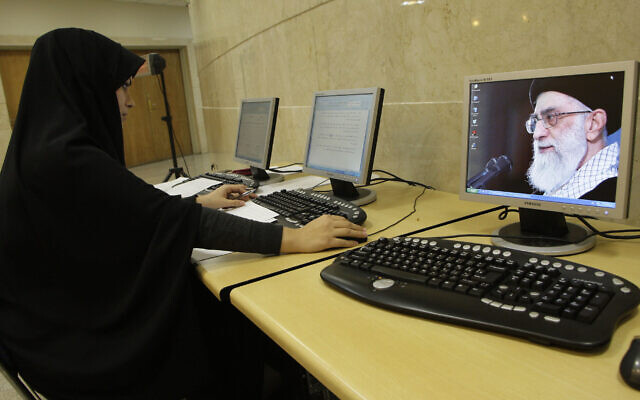 A female employee of the Iranian Interior Ministry works on her computer, as a portrait of supreme leader Ayatollah Ali Khamenei is seen on a screen, in Tehran, Dec. 27, 2011. (AP Photo/Vahid Salemi) A female employee of the Iranian Interior Ministry works on her computer, as a portrait of supreme leader Ayatollah Ali Khamenei is seen on a screen, in Tehran, Dec. 27, 2011. (AP Photo/Vahid Salemi)