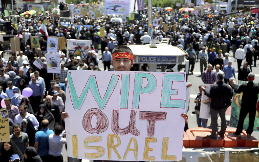 An Iranian protester holds an anti-Israeli placard during an annual anti-Israeli Al-Quds Day rally in Tehran, Iran, June 8, 2018. (AP Photo/Ebrahim Noroozi/File)
