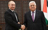 File - Palestinian Authority President Mahmoud Abbas, right, shakes hands with Russian President Vladimir Putin, during a meeting in Bethlehem, January 23, 2020. (Alexander Nemenov, Pool via AP)