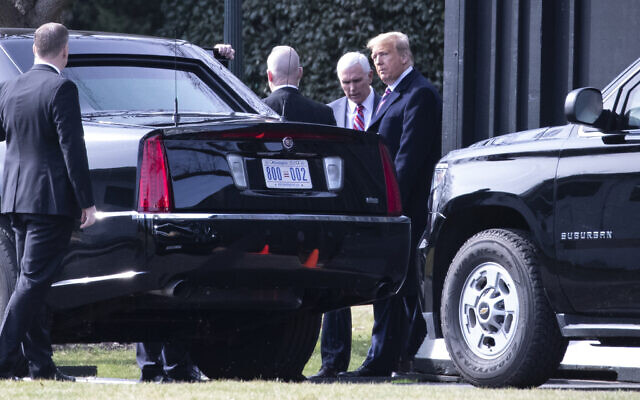 US President Donald Trump and Vice President Mike Pence talk before Trump gets in his car to depart the White House, February 18, 2020. (AP Photo/Alex Brandon) US President Donald Trump and Vice President Mike Pence talk before Trump gets in his car to depart the White House, February 18, 2020. (AP Photo/Alex Brandon)
