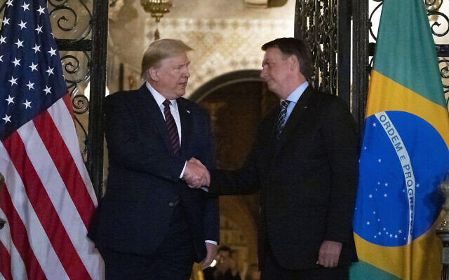 In this March 7, 2020, file photo US President Donald Trump shakes hands before a dinner with Brazilian President Jair Bolsonaro at Mar-a-Lago in Palm Beach, Florida (AP Photo/Alex Brandon, FIle) In this March 7, 2020, file photo US President Donald Trump shakes hands before a dinner with Brazilian President Jair Bolsonaro at Mar-a-Lago in Palm Beach, Florida (AP Photo/Alex Brandon, FIle)