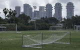In this March 28, 2020 photo, a closed training soccer field is seen during lockdown following government measures to help stop the spread of the coronavirus in Tel Aviv, Israel (AP Photo/Oded Balilty)