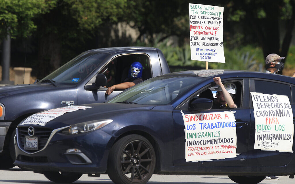 Illustrative: Pasadena day laborers and supporters hold a 'COVID-19-safe car rally' to protest what they say is an exclusion of workers from financial protection in the wake of the current pandemic for essential immigrant workers outside the city hall in Pasadena, California, Wednesday, April 29, 2020. (AP Photo/Damian Dovarganes)