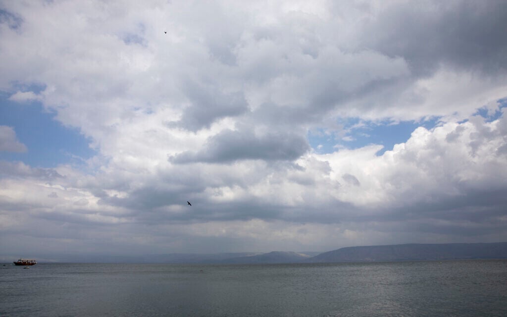 In this April 25, 2020 photo, birds fly while an empty tourist ship is anchored in the Sea of Galilee, locally known as Lake Kinneret (AP Photo/Ariel Schalit)