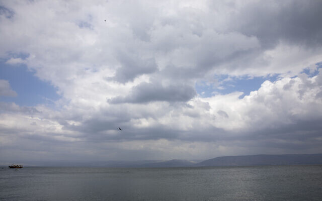 In this April 25, 2020 photo, birds fly while an empty tourist ship is anchored in the Sea of Galilee, locally known as Lake Kinneret (AP Photo/Ariel Schalit)