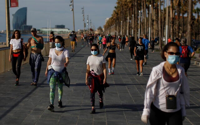 People walk along a seafront promenade in Barcelona, Spain, May 2, 2020 (AP Photo/Emilio Morenatti) People walk along a seafront promenade in Barcelona, Spain, May 2, 2020 (AP Photo/Emilio Morenatti)