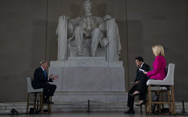 US President Donald Trump speaks during a Fox News virtual town hall from the Lincoln Memorial, Sunday, May 3, 2020, in Washington. (AP Photo/Evan Vucci) US President Donald Trump speaks during a Fox News virtual town hall from the Lincoln Memorial, Sunday, May 3, 2020, in Washington. (AP Photo/Evan Vucci)