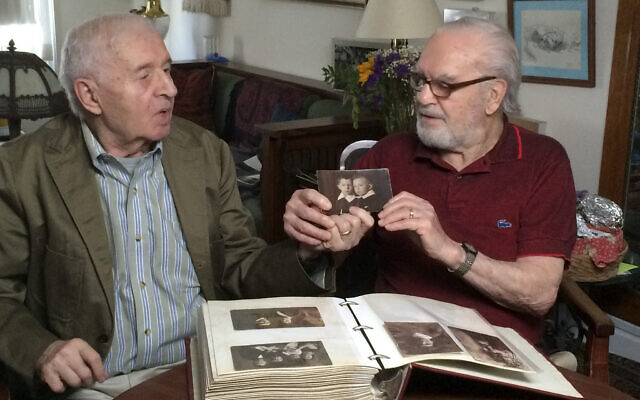 Brothers Alexander Feingold, left, and Joseph Feingold look at photo of themselves as boys in Joseph's apartment in New York on June 8, 2015 (Raphaela Neihausen via AP) Brothers Alexander Feingold, left, and Joseph Feingold look at photo of themselves as boys in Joseph's apartment in New York on June 8, 2015 (Raphaela Neihausen via AP)