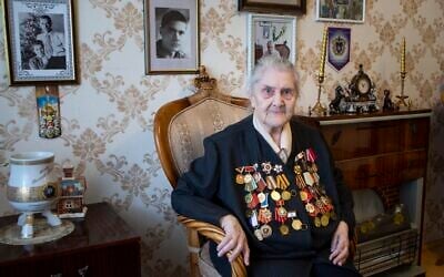 Valentina Efremova, a 96-year-old World War II veteran, who served as a nurse in field hospitals on the frontlines throughout the war, speaks during her interview with the Associated Press in Yakutsk, Russia, April 30, 2020 . (AP Photo/Alex Lee)