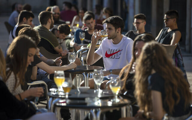 Customers drink on a terrace bar in Tarragona, Spain, Monday, May 11, 2020. (AP/Emilio Morenatti) Customers drink on a terrace bar in Tarragona, Spain, Monday, May 11, 2020. (AP/Emilio Morenatti)