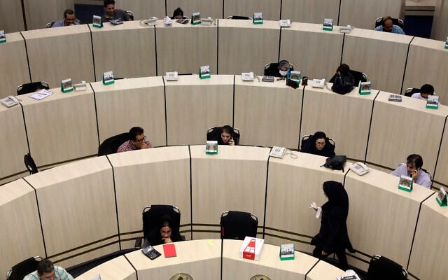 In this May 10, 2020 photo, stockbrokers work at the Tehran Stock Exchange in Iran (AP Photo/Vahid Salemi) In this May 10, 2020 photo, stockbrokers work at the Tehran Stock Exchange in Iran (AP Photo/Vahid Salemi)