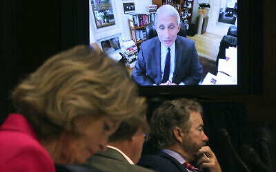 Senators listen as Dr. Anthony Fauci, director of the National Institute of Allergy and Infectious Diseases, speaks remotely during a virtual Senate Committee for Health, Education, Labor, and Pensions hearing, Tuesday, May 12, 2020 on Capitol Hill in Washington. (Win McNamee/Pool via AP)
