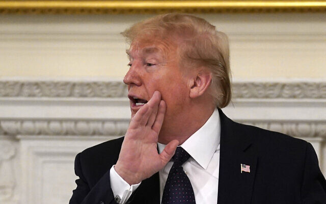 US President Donald Trump after a meeting with restaurant industry executives about the coronavirus response, in the State Dining Room of the White House, in Washington, May 18, 2020. (AP Photo/Evan Vucci) US President Donald Trump after a meeting with restaurant industry executives about the coronavirus response, in the State Dining Room of the White House, in Washington, May 18, 2020. (AP Photo/Evan Vucci)