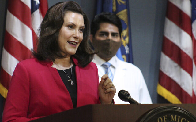 In this Thursday, May 21, 2020 photo provided by the Michigan Office of the Governor, Michigan Gov. Gretchen Whitmer speaks during a news conference in Lansing, Mich. (Michigan Office of the Governor via AP, Pool) In this Thursday, May 21, 2020 photo provided by the Michigan Office of the Governor, Michigan Gov. Gretchen Whitmer speaks during a news conference in Lansing, Mich. (Michigan Office of the Governor via AP, Pool)