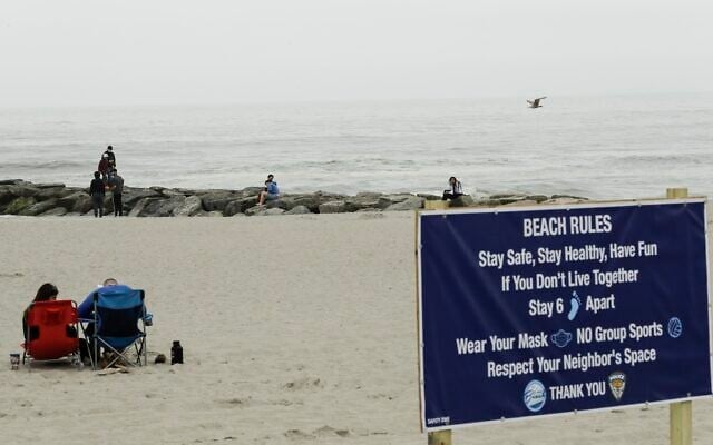 People engage in social distancing on the beach during the coronavirus pandemic, Friday, May 22, 2020, in Long Beach, N.Y. (AP/Frank Franklin II) People engage in social distancing on the beach during the coronavirus pandemic, Friday, May 22, 2020, in Long Beach, N.Y. (AP/Frank Franklin II)